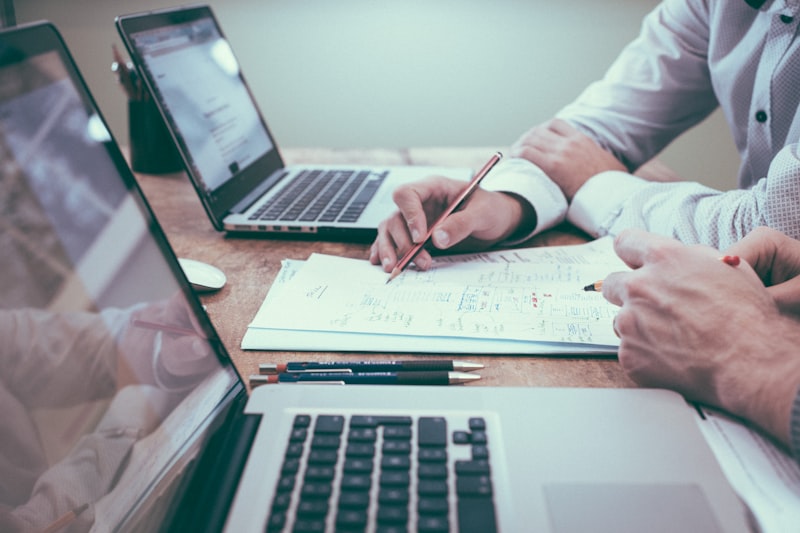 Professional reviewing a document at a desk